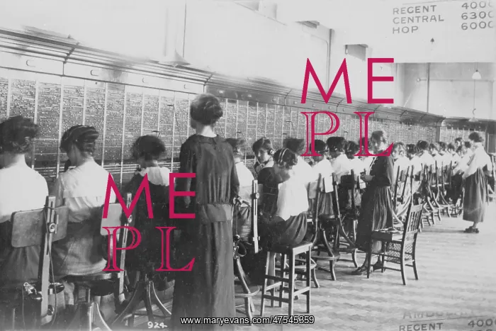 : A long line of telephone switchboards : A long line of telephone switchboards