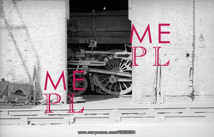: Looking across tracks to detail of steam engine in shed : Looking across tracks to detail of steam engine in shed