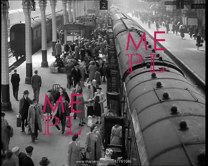 : Looking Down Along a Train Platform With Passengers : Looking Down Along a Train Platform With Passengers