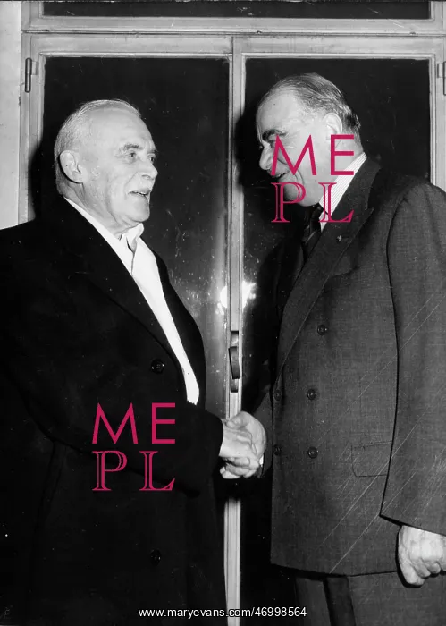 : Lord Ismay shaking hands with another politician : Lord Ismay shaking hands with another politician