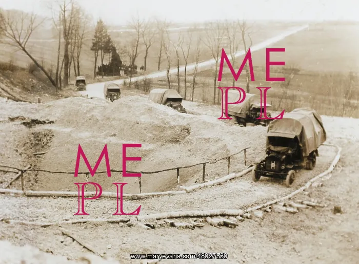 : Lorries passing mine crater on way to Western Front, WW1 : Lorries passing mine crater on way to Western Front, WW1