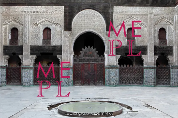 : Fez. Low angle view of central courtyard with pool in the foreground : Fez. Low angle view of central courtyard with pool in the foreground
