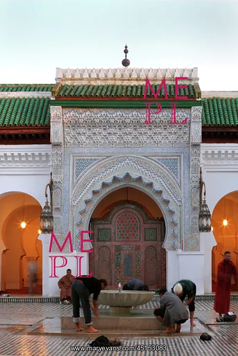 : Fez. Low angle view of men washing their feet in the courtyard, Mosque : Fez. Low angle view of men washing their feet in the courtyard, Mosque