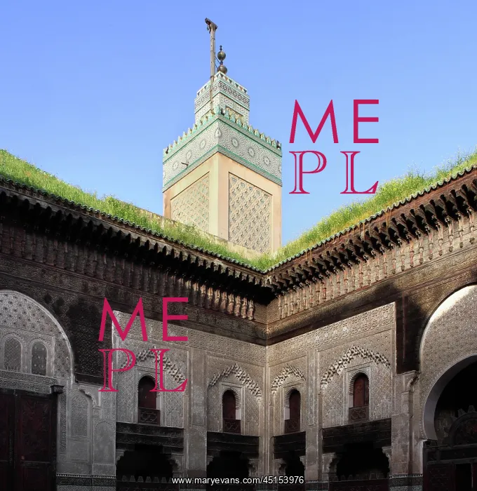 : Fez. Low angle view of minaret above corner of courtyard : Fez. Low angle view of minaret above corner of courtyard