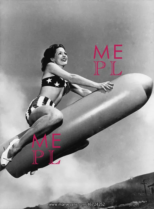 : Low angle view of a young woman sitting on a rocket : Low angle view of a young woman sitting on a rocket