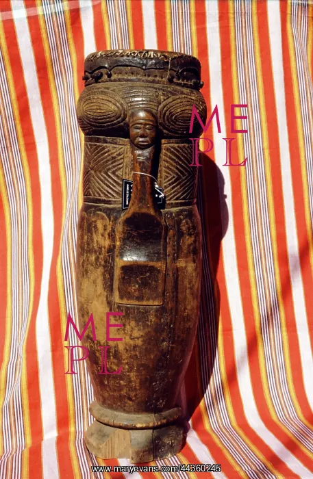 : Lunda carved cylindrical drum with image of human face : Lunda carved cylindrical drum with image of human face