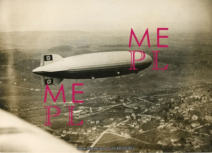 : The LZ129 Hindenburg over Friedrichshafen during a test : The LZ129 Hindenburg over Friedrichshafen during a test