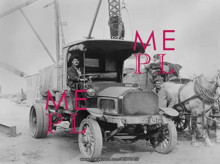 : Mack Truck, workers, and horses at a construction : Mack Truck, workers, and horses at a construction