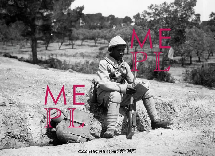: Madagascan soldier reading : Madagascan soldier reading