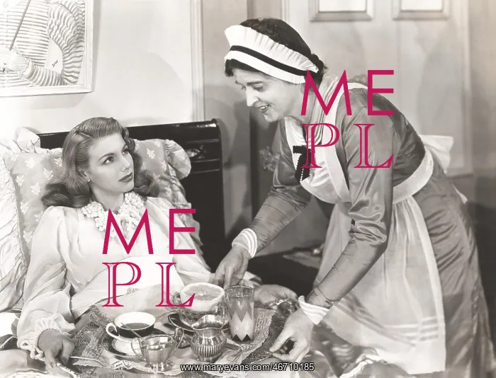 : Maid serving breakfast to woman lying in bed : Maid serving breakfast to woman lying in bed