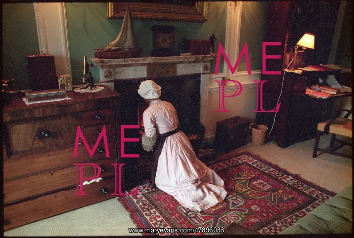 : MAID TENDS TO FIRE : MAID TENDS TO FIRE