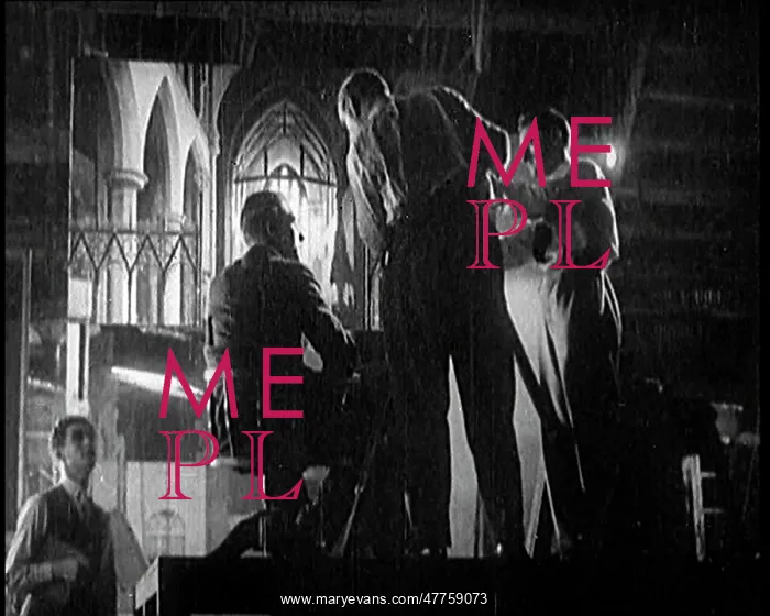 : Four Male Film Technicians At Work Around A Camera : Four Male Film Technicians At Work Around A Camera