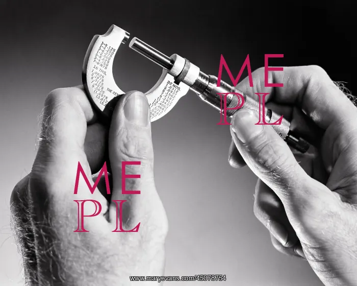 : Male Hands Holding a Micrometer Gauge : Male Hands Holding a Micrometer Gauge