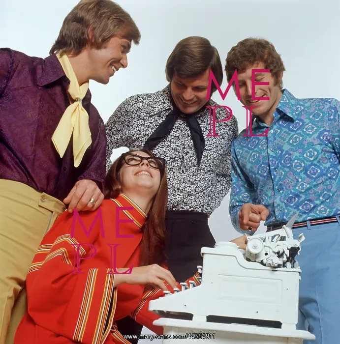 : Three male models with female typist : Three male models with female typist