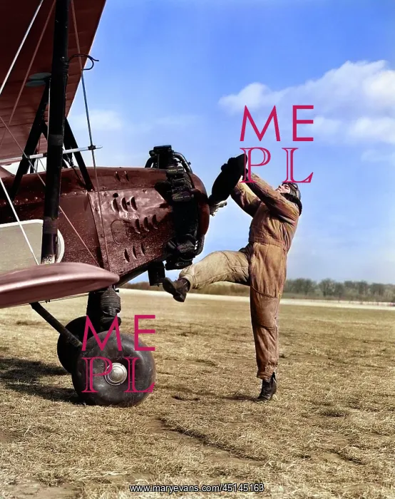 : Male Pilot Trying To Turn Plane'S Propeller : Male Pilot Trying To Turn Plane'S Propeller