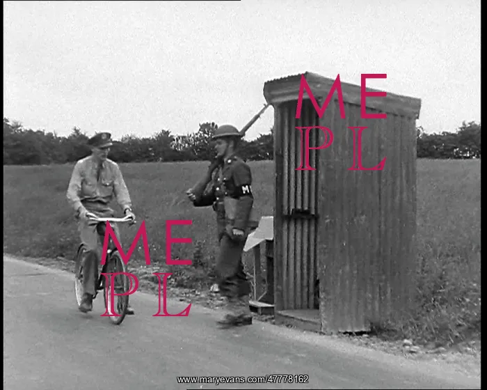 : A Male Soldier Manning a Checkpoint on a Road : A Male Soldier Manning a Checkpoint on a Road