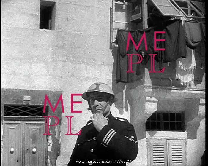: Maltese Air Raid Warden Equipping a Protective Helmet : Maltese Air Raid Warden Equipping a Protective Helmet