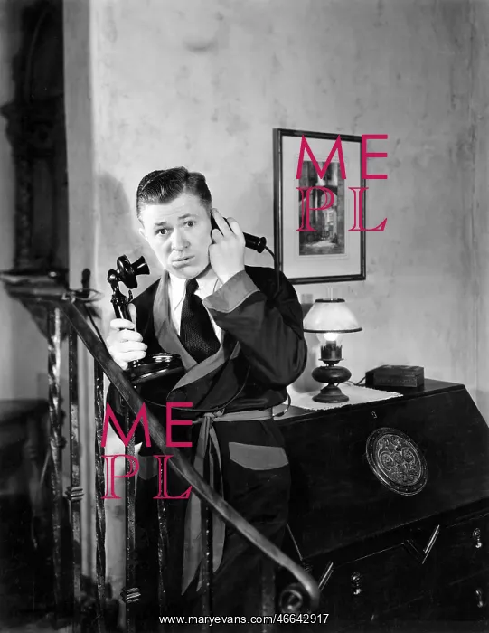 : Man in his apartment listening on his telephone : Man in his apartment listening on his telephone