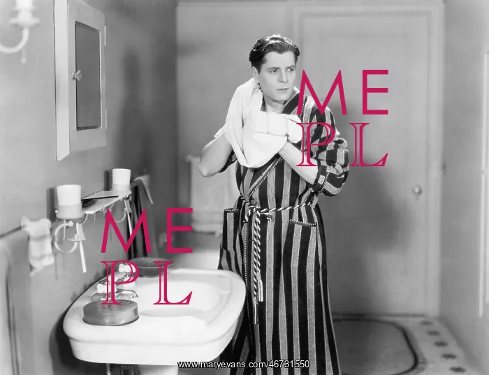 : Man in the bathroom drying his neck
