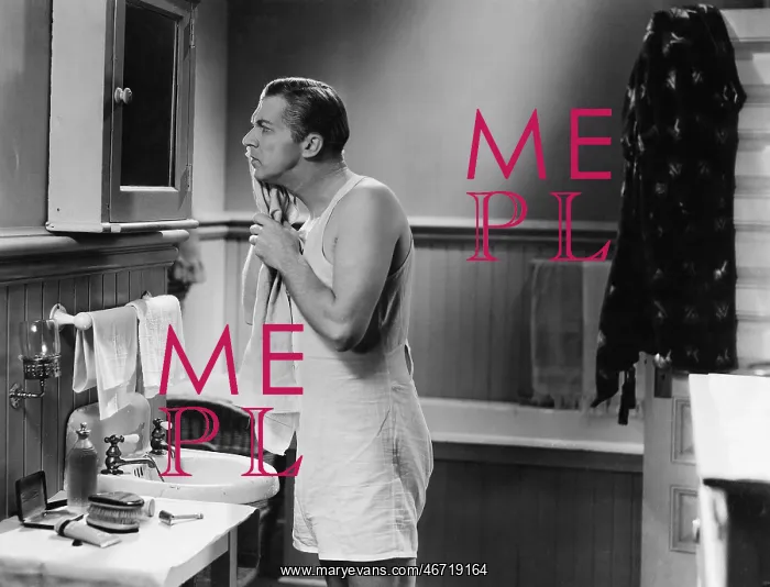  : Man at bathroom mirror