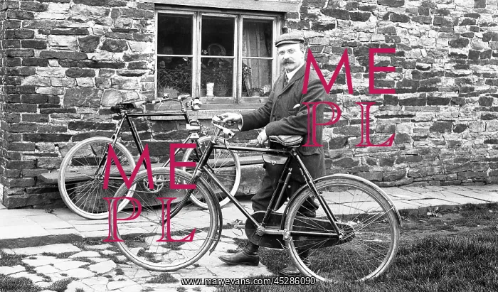  : Man with bicycles outside house
