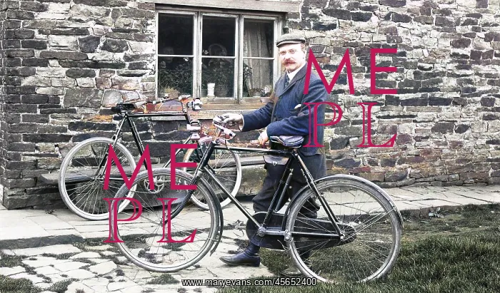 : Man with bicycles outside house : Man with bicycles outside house