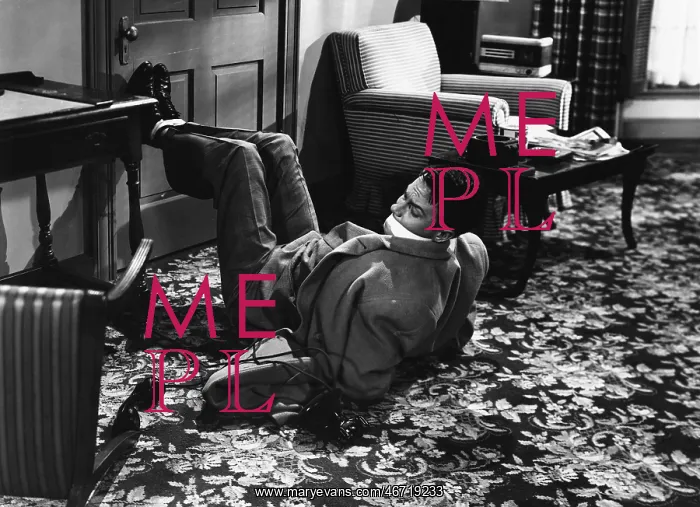 : Man bound and gagged on floor : Man bound and gagged on floor