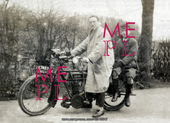 : Man & boy on a 1914 Levis motorcycle : Man & boy on a 1914 Levis motorcycle