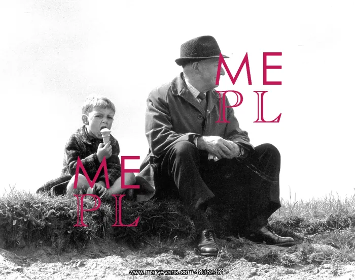 : Man and boy having a sit down : Man and boy having a sit down