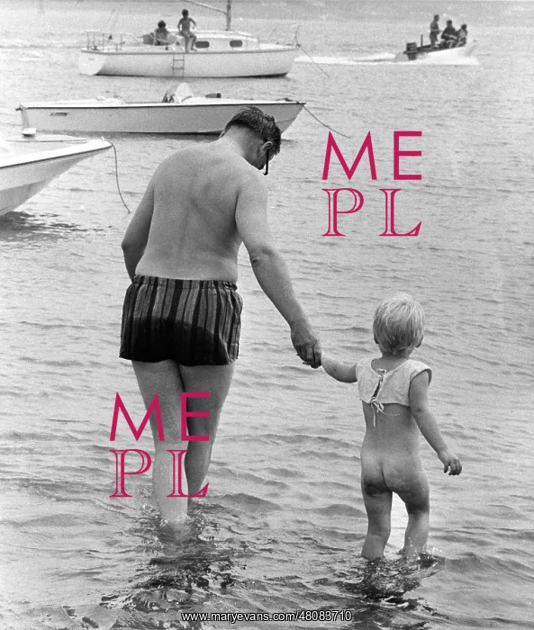 : Man and boy paddling in the sea : Man and boy paddling in the sea