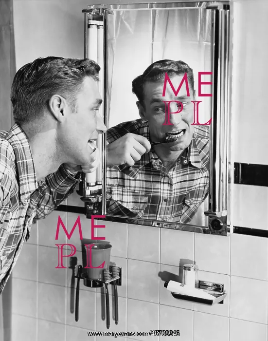 : Man brushing his teeth in bathroom mirror : Man brushing his teeth in bathroom mirror