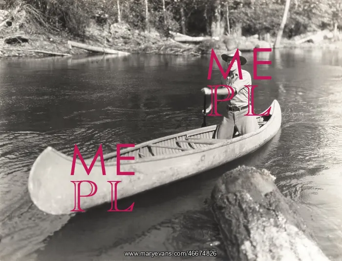 : Man canoeing down river : Man canoeing down river