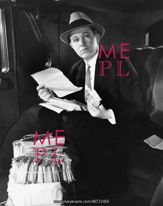  : Man in car with bundles of mail
