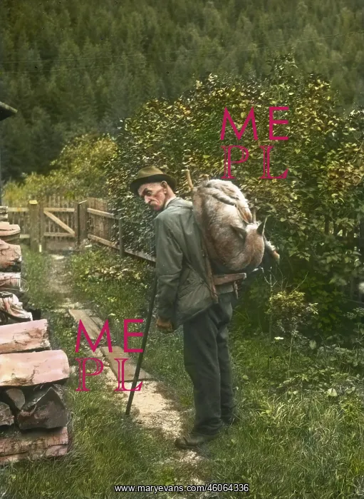 : Man carrying a shot chamois : Man carrying a shot chamois