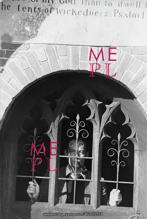 : Man behind carved grille with biblical quotation above : Man behind carved grille with biblical quotation above
