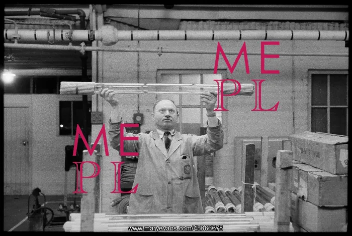 : A man checking completed glass tubes at the Wear : A man checking completed glass tubes at the Wear