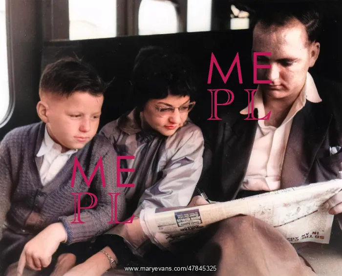  : Man and two children doing the crossword on a train