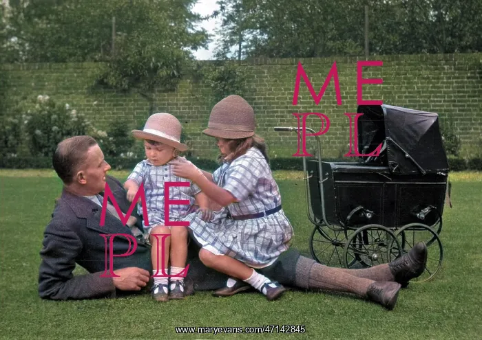 : Man with two children and a toy pram : Man with two children and a toy pram