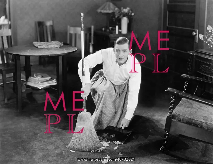  : Man cleaning up with a broom