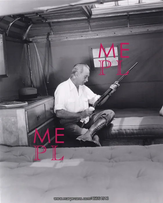 : Man cleaning his rifle : Man cleaning his rifle