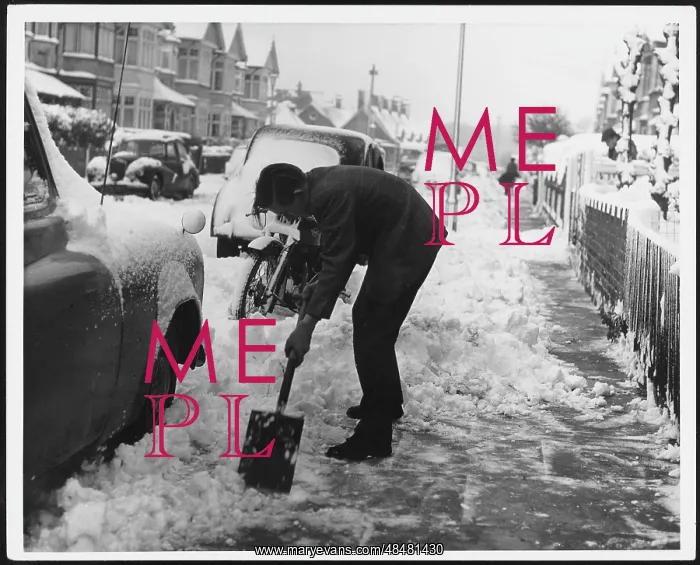 : MAN CLEARS SNOW : MAN CLEARS SNOW