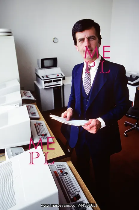 : Man Computer Systems Salesman Standing Looking : Man Computer Systems Salesman Standing Looking