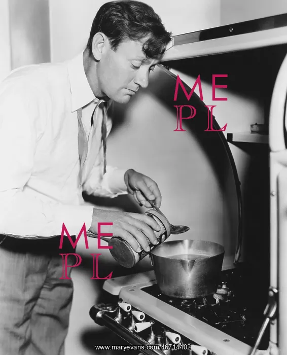 : Man cooking on stove : Man cooking on stove