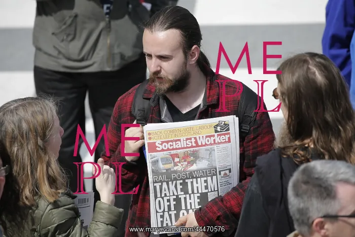 : Man With Copy Of Socialist Worker Newspaper : Man With Copy Of Socialist Worker Newspaper