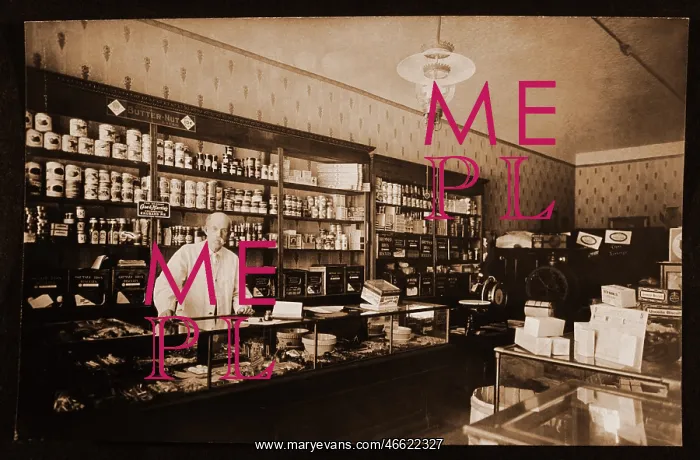 : Man behind counter in grocery store : Man behind counter in grocery store