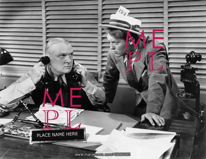 : Man at desk on telephone : Man at desk on telephone