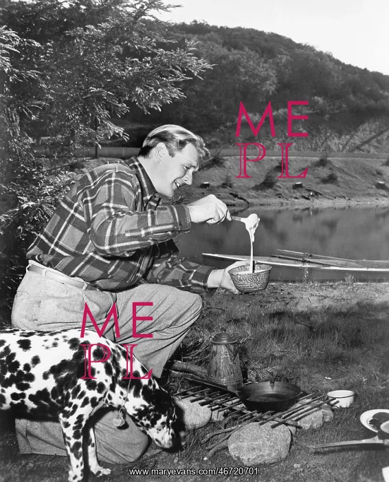 : Man and his dog camping and preparing food : Man and his dog camping and preparing food
