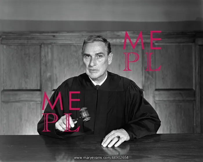: Man dressed as judge sitting inside holding : Man dressed as judge sitting inside holding