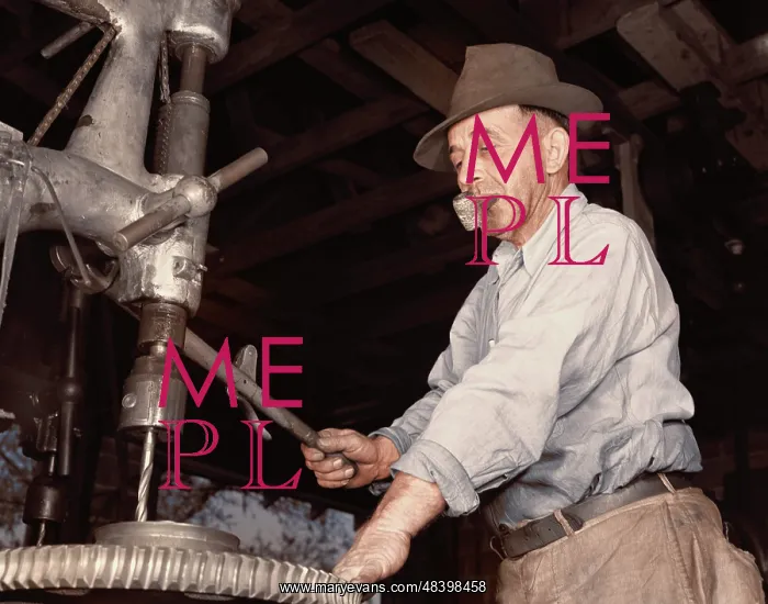 : Man drilling a gear for the De Land community : Man drilling a gear for the De Land community