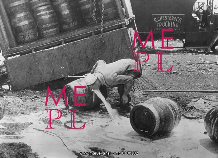 : Man drinking from a beer keg, 1943 : Man drinking from a beer keg, 1943